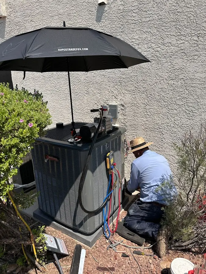 HVAC technician performing outdoor AC maintenance in American Canyon